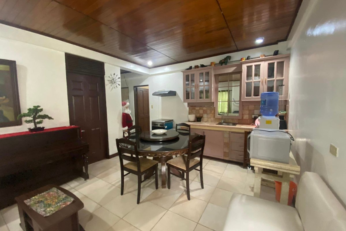 For Rent Apartment Inside gated subdivision in Banilad (1) Living area of the 1-bedroom apartment for rent in Cebu City
