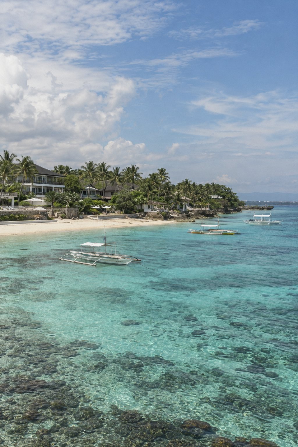 Turquoise lagoon and beachfront resorts on Mactan Island, Lapu-Lapu City